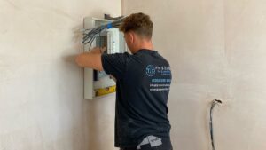Electrician carrying out electrical testing